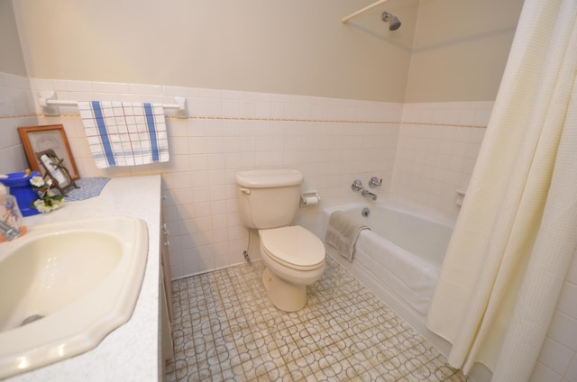 full bathroom featuring sink, tile walls, shower / bath combination with curtain, toilet, and tile patterned floors