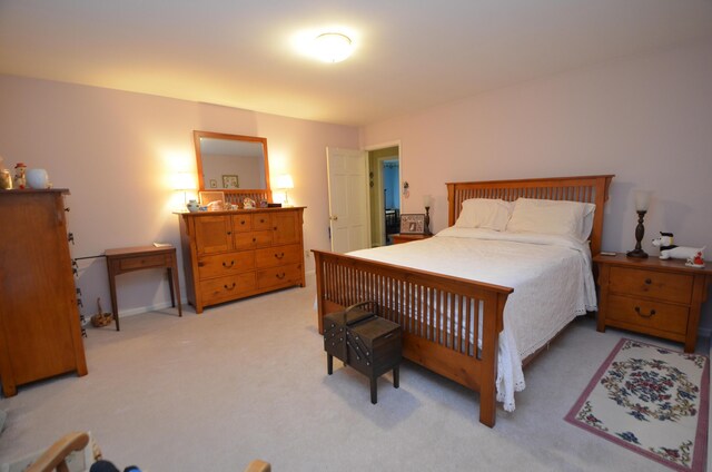 bedroom with light carpet