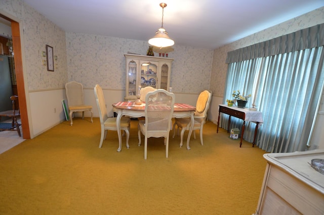 view of carpeted dining area