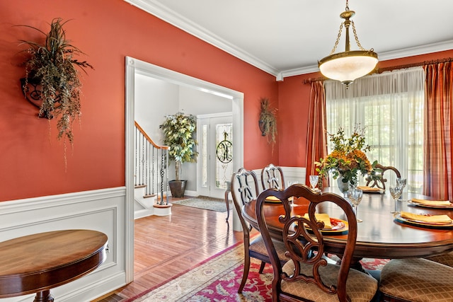 2040 Indigo Dr, Richmond, KY 40475 - dining space featuring crown molding, a wainscoted wall, stairway, and wood finished floors