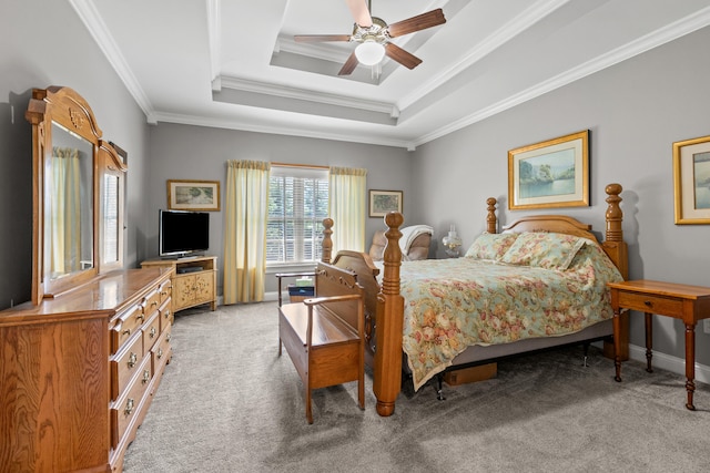 bedroom with light carpet, crown molding, a raised ceiling, and ceiling fan