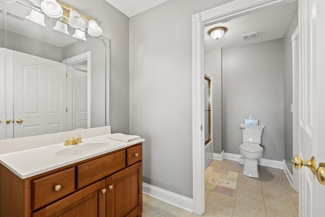 full bathroom featuring vanity, tile patterned floors, shower / bath combination with glass door, and toilet