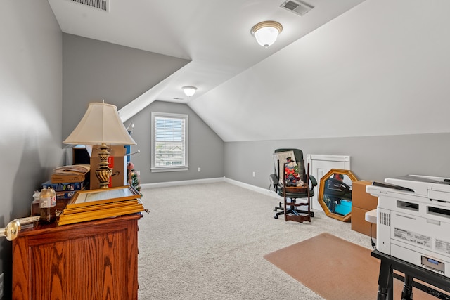 interior space with lofted ceiling and light carpet