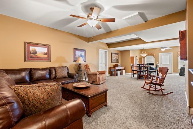 carpeted living room featuring beam ceiling and ceiling fan