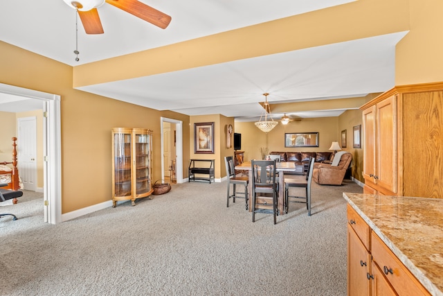 2040 Indigo Dr, Richmond, KY 40475 - dining room featuring light carpet, a ceiling fan, and baseboards