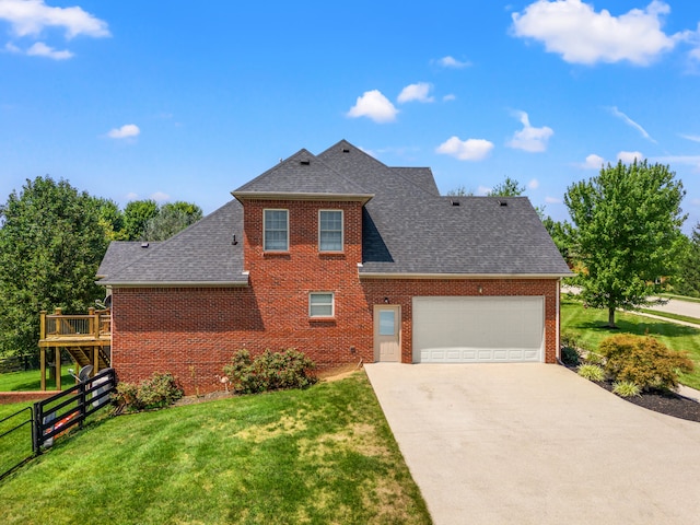 view of front of home with a wooden deck, a garage, and a front yard