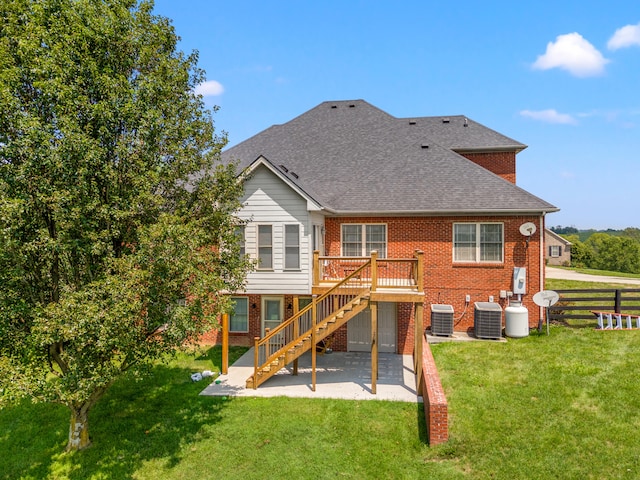 2040 Indigo Dr, Richmond, KY 40475 - rear view of property featuring a patio, brick siding, stairs, a wooden deck, and a shingled roof