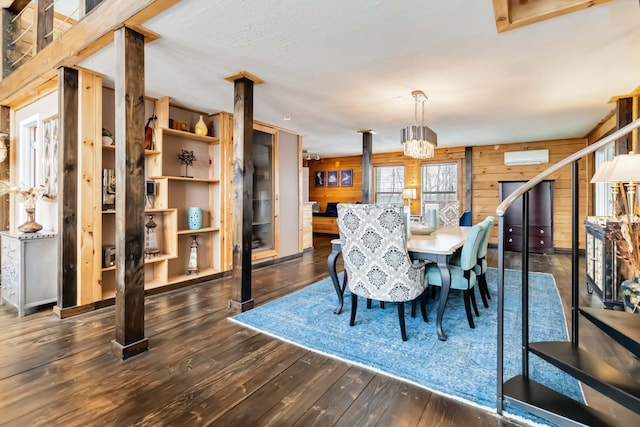 489 Sally J Rd, Mount Vernon, KY 40456 - dining area featuring wooden walls, hardwood / wood-style flooring, an AC wall unit, and decorative columns
