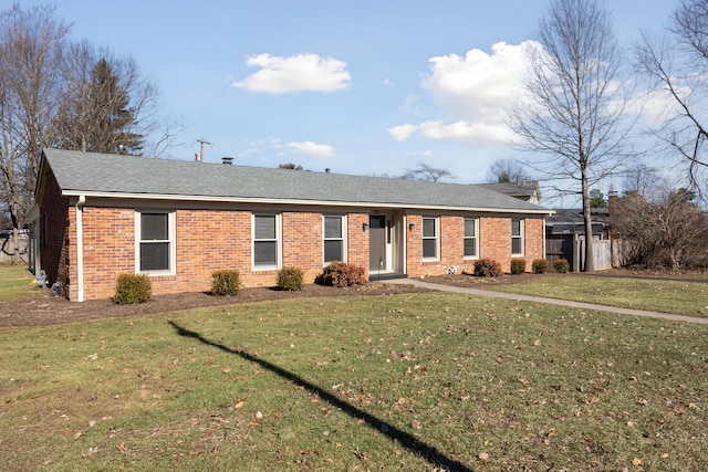 ranch-style house featuring a front lawn