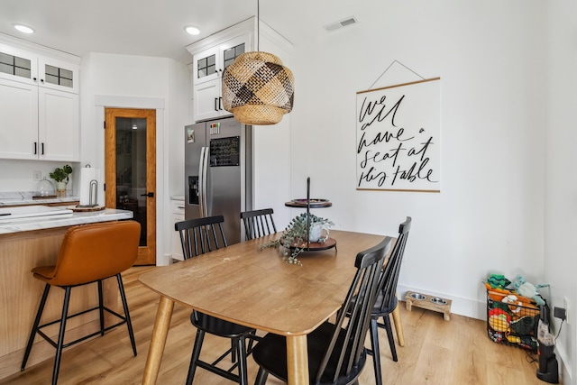 dining room featuring light hardwood / wood-style flooring