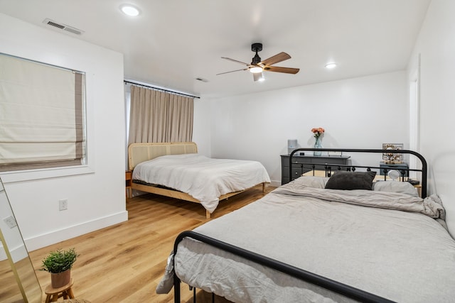 bedroom with wood-type flooring and ceiling fan