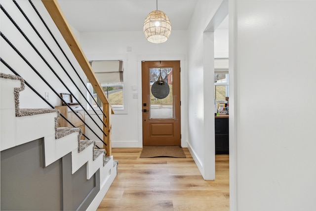 entryway with light hardwood / wood-style flooring