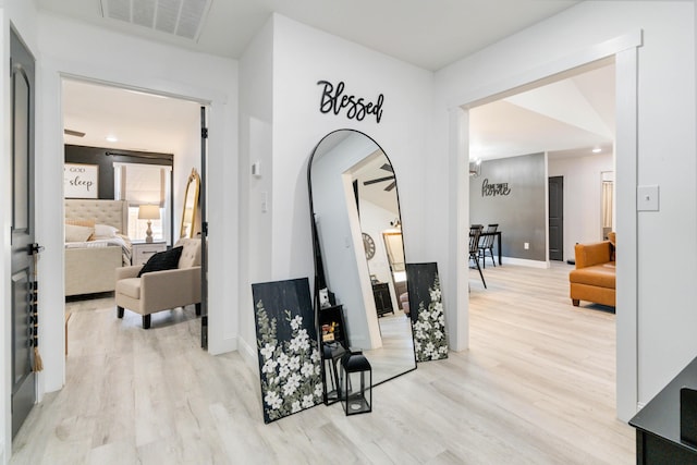 hallway featuring light hardwood / wood-style flooring