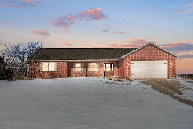 ranch-style home featuring a garage