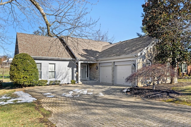 view of front of property with a garage