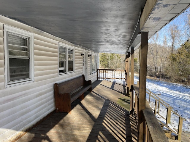 view of snow covered deck