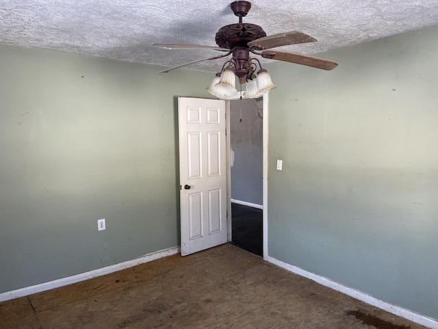 spare room with ceiling fan and a textured ceiling