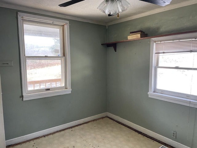 unfurnished room featuring a textured ceiling and ceiling fan