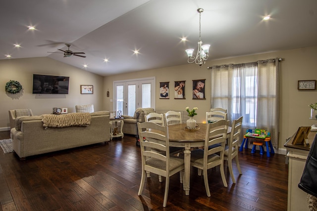 dining room with dark hardwood / wood-style flooring, vaulted ceiling, and plenty of natural light