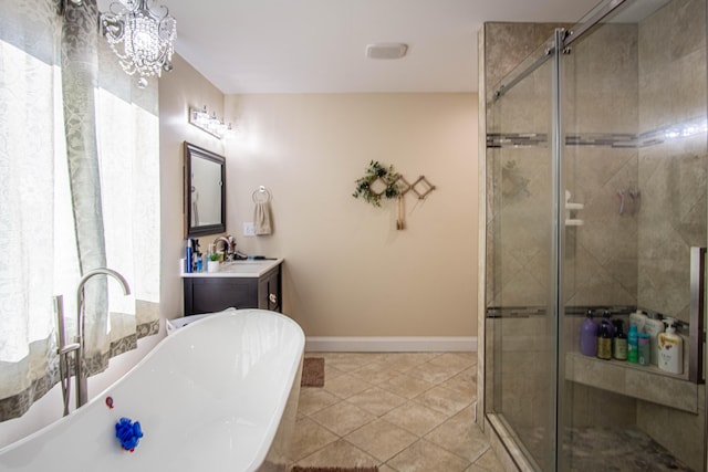 bathroom featuring tile patterned flooring, vanity, separate shower and tub, and an inviting chandelier