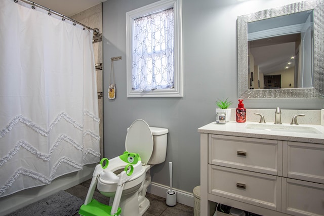 bathroom featuring vanity, curtained shower, tile patterned floors, and toilet