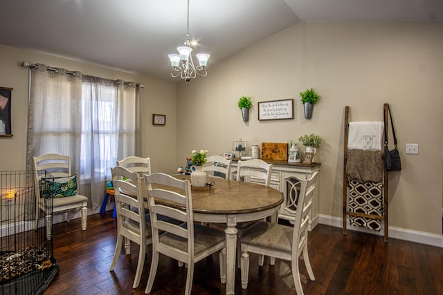 dining room featuring dark wood-type flooring, a chandelier, and vaulted ceiling