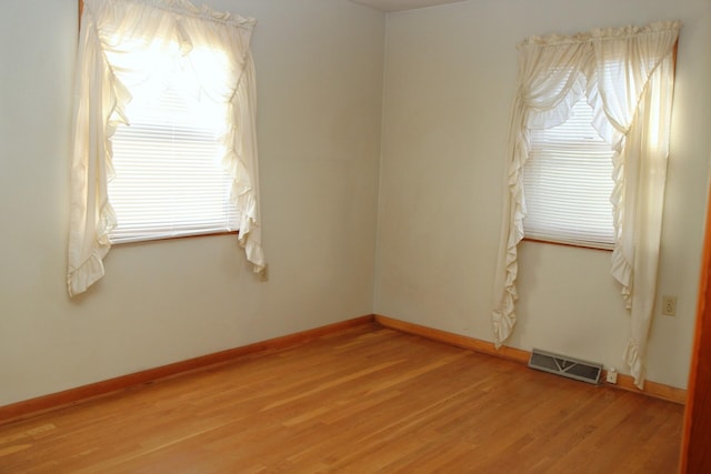 unfurnished room featuring wood-type flooring