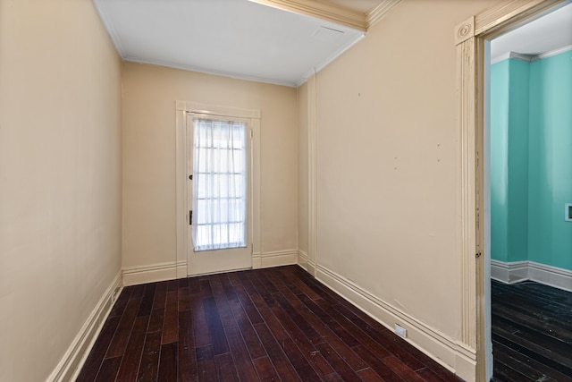 doorway to outside with ornamental molding and wood-type flooring