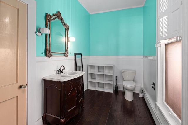 bathroom with hardwood / wood-style flooring, vanity, and toilet