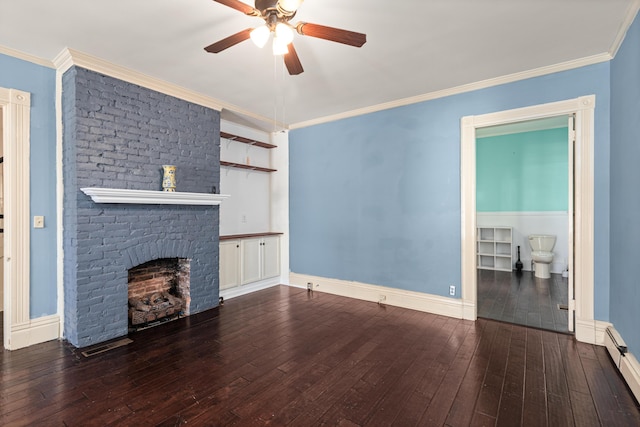 unfurnished living room featuring ornamental molding, dark hardwood / wood-style flooring, and a brick fireplace