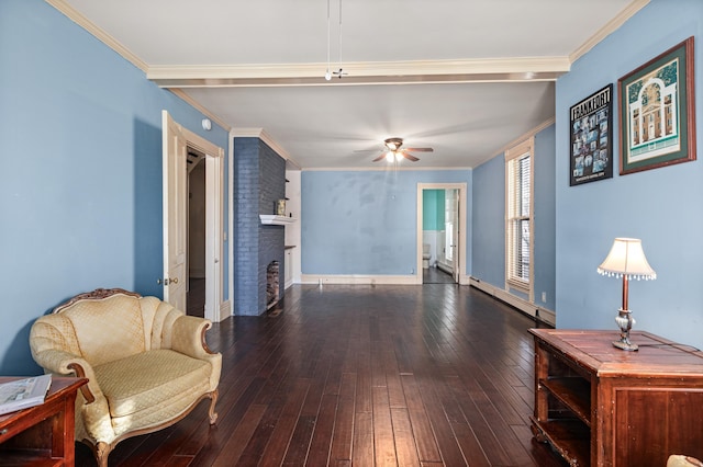 living area with crown molding, a brick fireplace, dark hardwood / wood-style floors, and ceiling fan