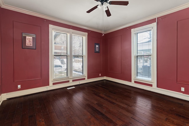 unfurnished room featuring crown molding, hardwood / wood-style flooring, a baseboard radiator, and ceiling fan