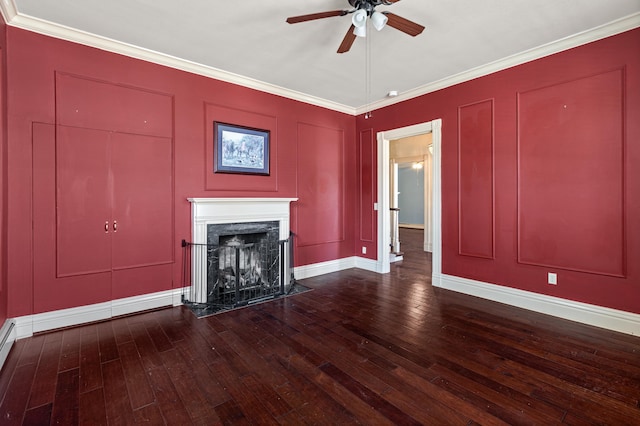 unfurnished living room featuring ornamental molding, wood-type flooring, and a fireplace