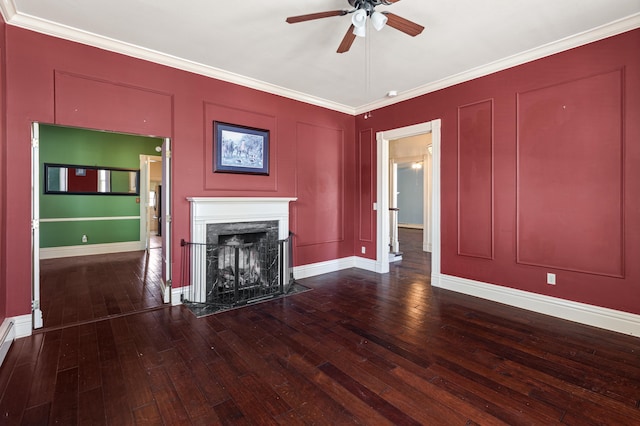 unfurnished living room with crown molding, wood-type flooring, and a fireplace