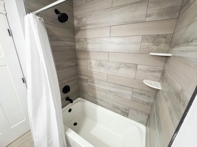 bathroom with shower / tub combo with curtain