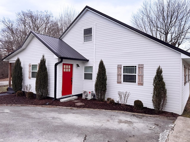 front of property featuring ac unit