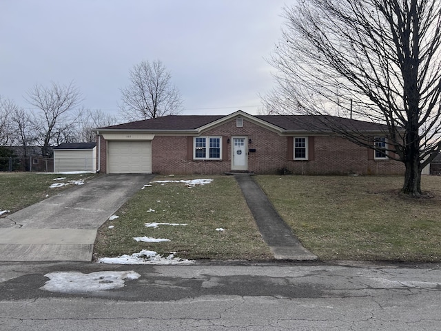 view of front of house featuring a garage and a front lawn