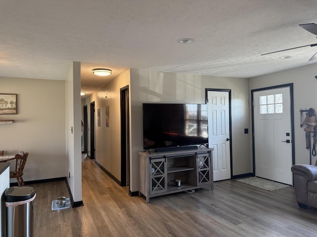 living room featuring hardwood / wood-style flooring and a textured ceiling