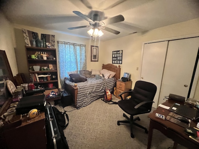 bedroom featuring ceiling fan, carpet floors, and a closet