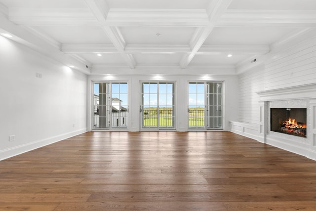 unfurnished living room featuring coffered ceiling, beam ceiling, crown molding, dark hardwood / wood-style flooring, and a premium fireplace