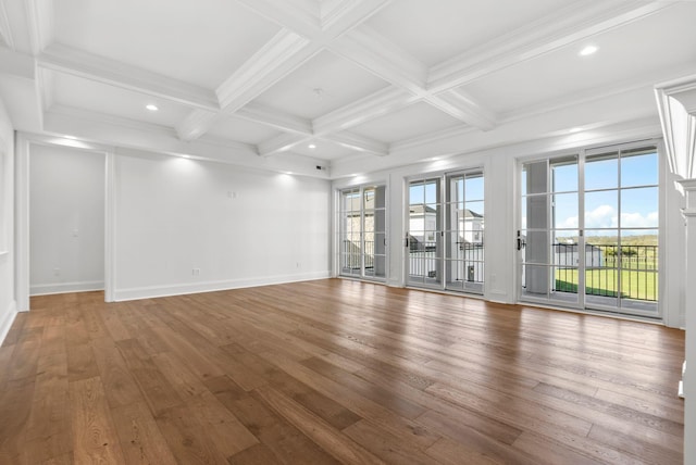 unfurnished room featuring coffered ceiling, beam ceiling, and wood-type flooring