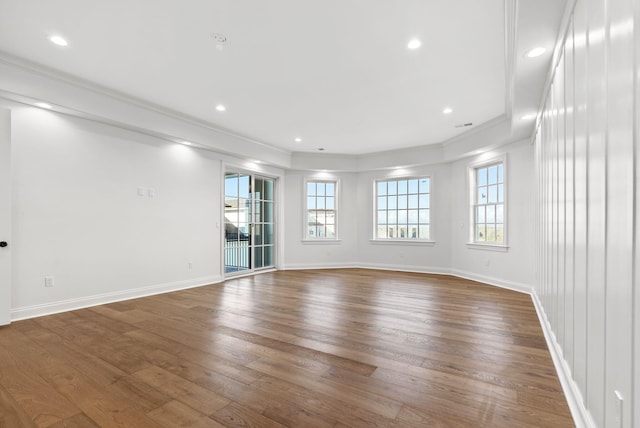 unfurnished room featuring crown molding and dark hardwood / wood-style flooring