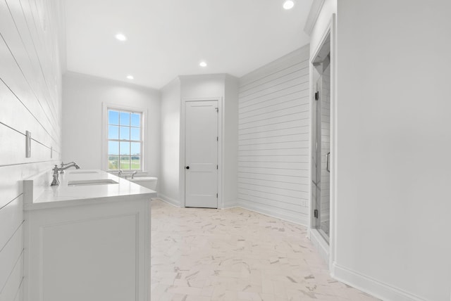 bathroom with an enclosed shower and vanity