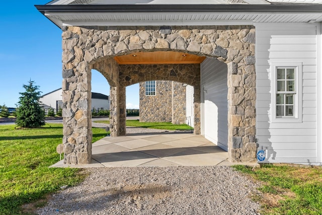 view of property's community with a garage and a lawn