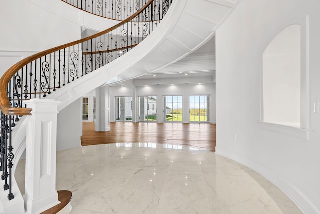 interior space featuring ornamental molding and decorative columns