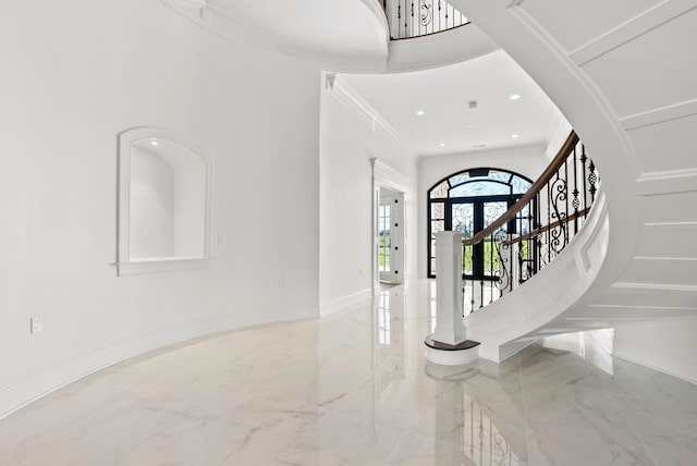 foyer entrance featuring ornamental molding