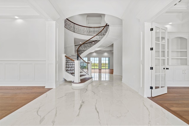 foyer entrance featuring ornamental molding