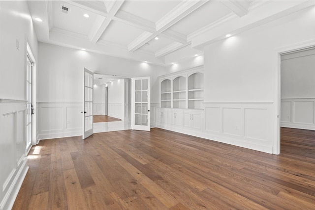 unfurnished room featuring built in features, dark hardwood / wood-style floors, coffered ceiling, french doors, and beamed ceiling