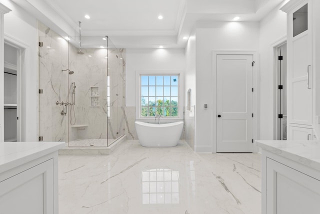 bathroom featuring ornamental molding, vanity, and plus walk in shower