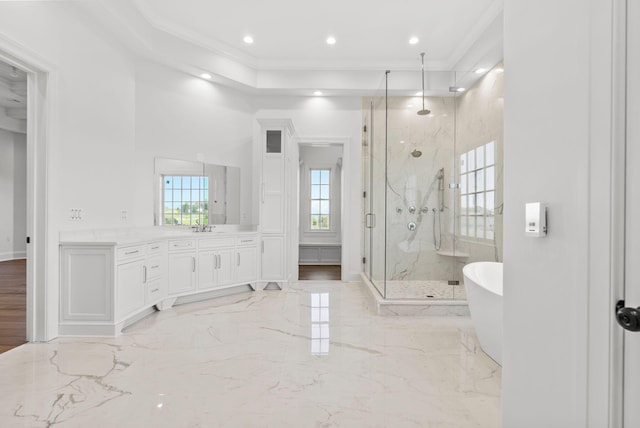 bathroom featuring crown molding, vanity, and plus walk in shower